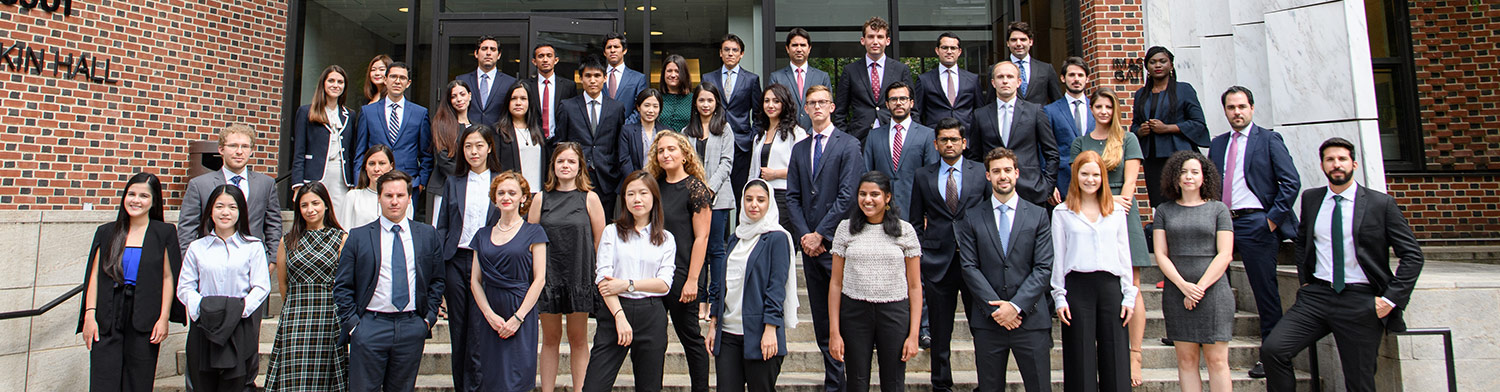 A landscape photograph of a group of Penn Carey Law LLM Program students posing together for a picture